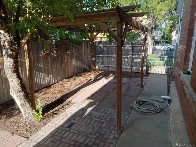 a view of swimming pool with outdoor seating and plants