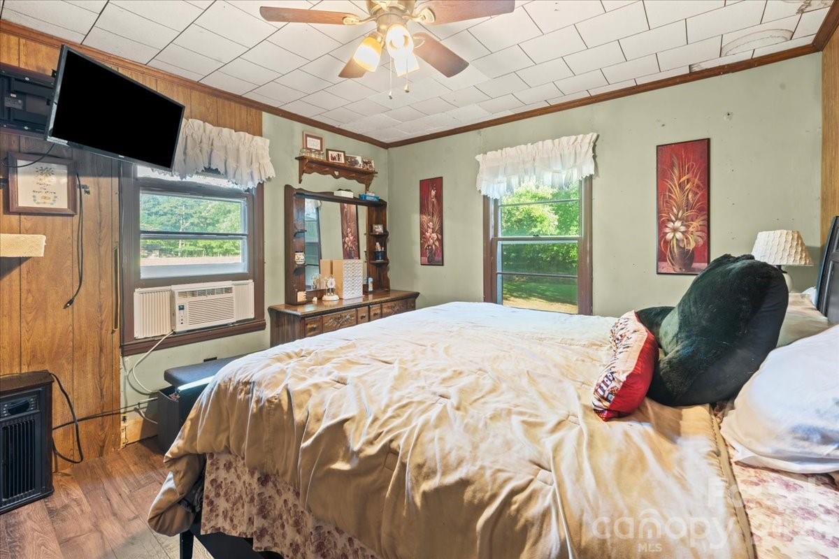 12282 Coyle Road Stanfield, NC 28163 - Photo 10 of 24 a bed sitting in a bedroom next to a window