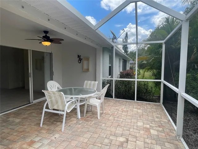 a view of a dining room with furniture wooden floor and chandelier