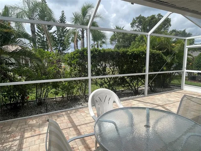 a view of roof deck with wooden floor and fence