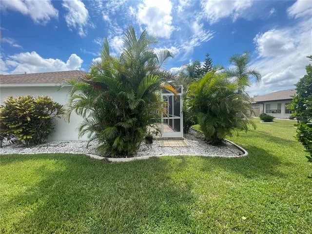 a view of a backyard of the house