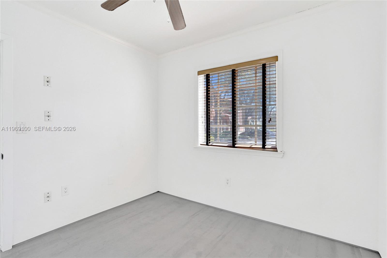 7783 Southwest 94th Lane, Unit 7783 Miami, FL 33156 - Photo 11 of 30 an empty room with a window