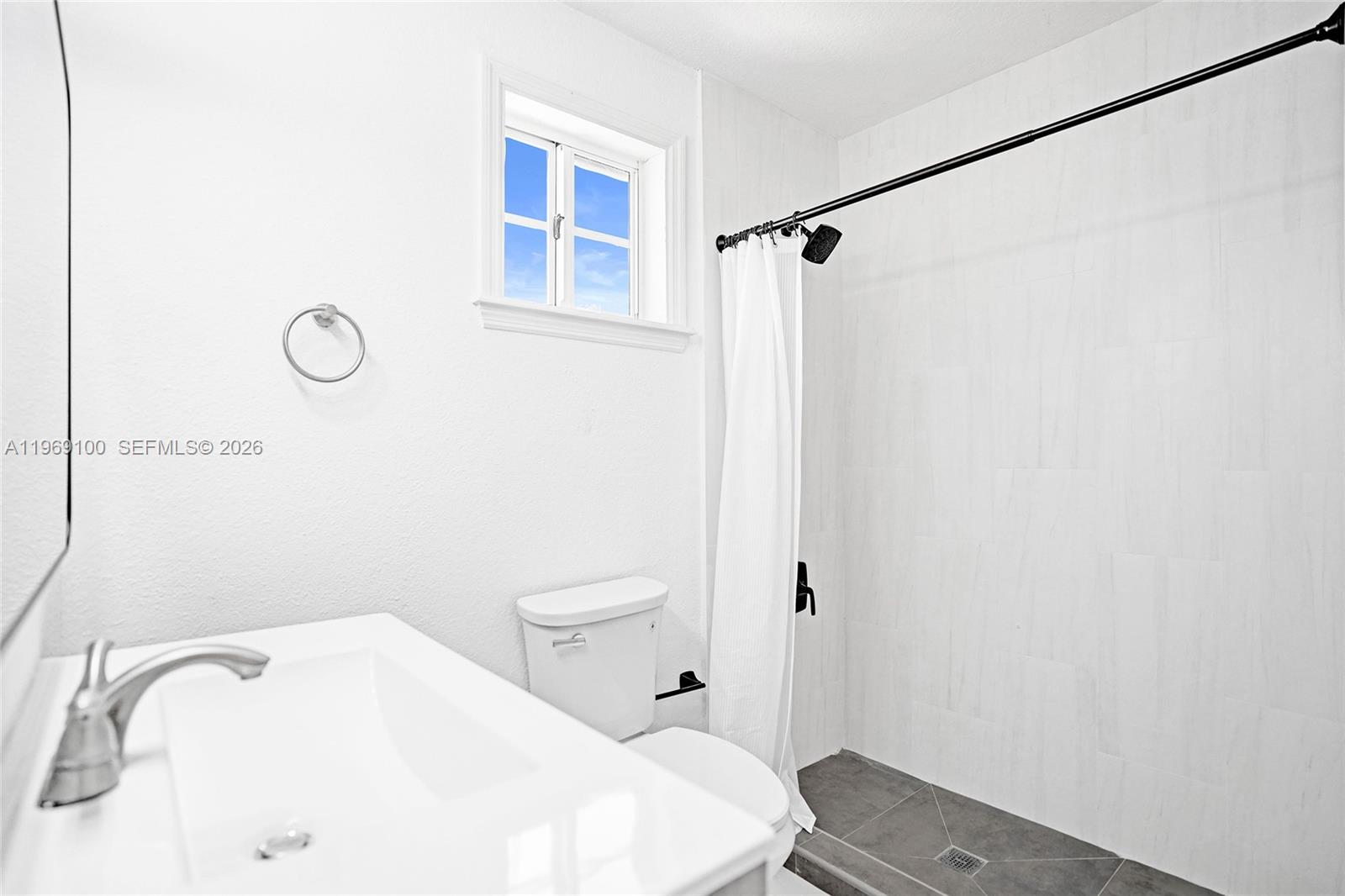 7783 Southwest 94th Lane, Unit 7783 Miami, FL 33156 - Photo 25 of 30 a bathroom with a toilet and a sink