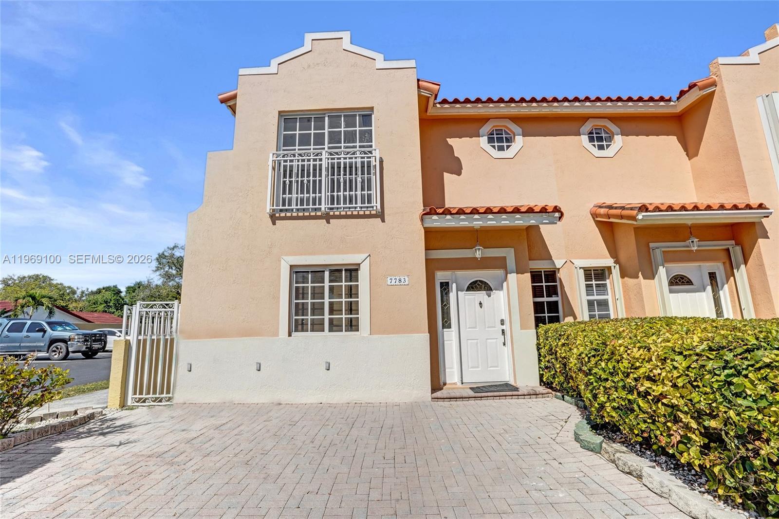 7783 Southwest 94th Lane, Unit 7783 Miami, FL 33156 - Photo 29 of 30 front view of a house with a porch