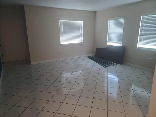 a view of an empty room and window