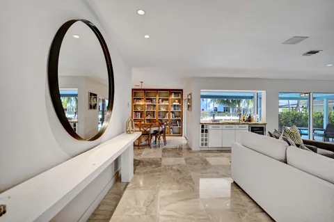 a kitchen with a sink a stove cabinets and a refrigerator