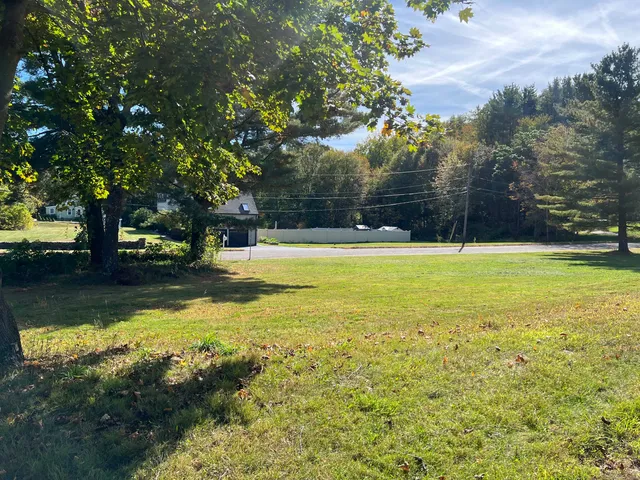 a view of a swimming pool with an outdoor space and seating area
