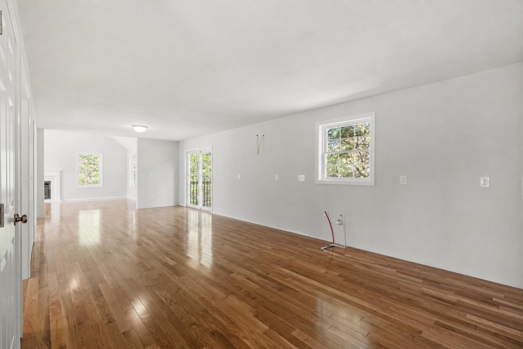 22 Benoit Avenue Pelham, NH 03076 - Photo 14 of 42 a view of an empty room with wooden floor and a window