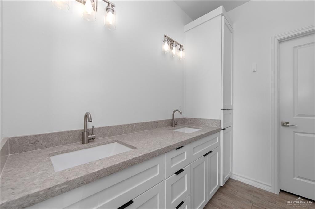 15688 Primera Road Harlingen, TX 78552 - Photo 15 of 20 a bathroom with a sink and vanity