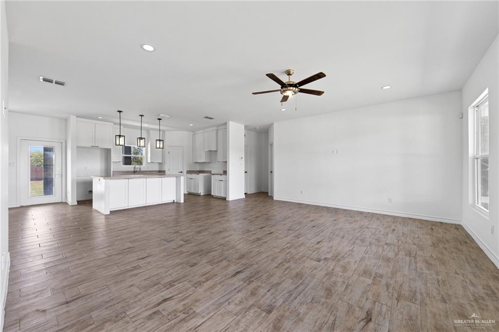 15688 Primera Road Harlingen, TX 78552 - Photo 3 of 20 a view of a kitchen with a dishwasher and wooden floor