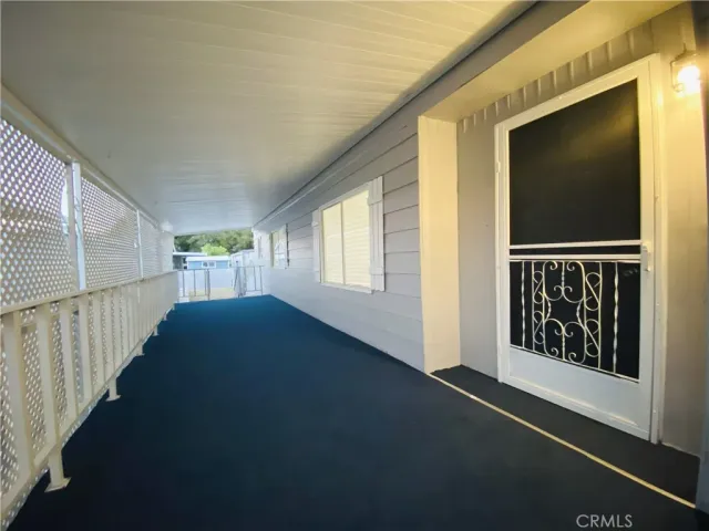 a living room with furniture and windows