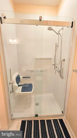 a large bed sitting in a bedroom next to a window