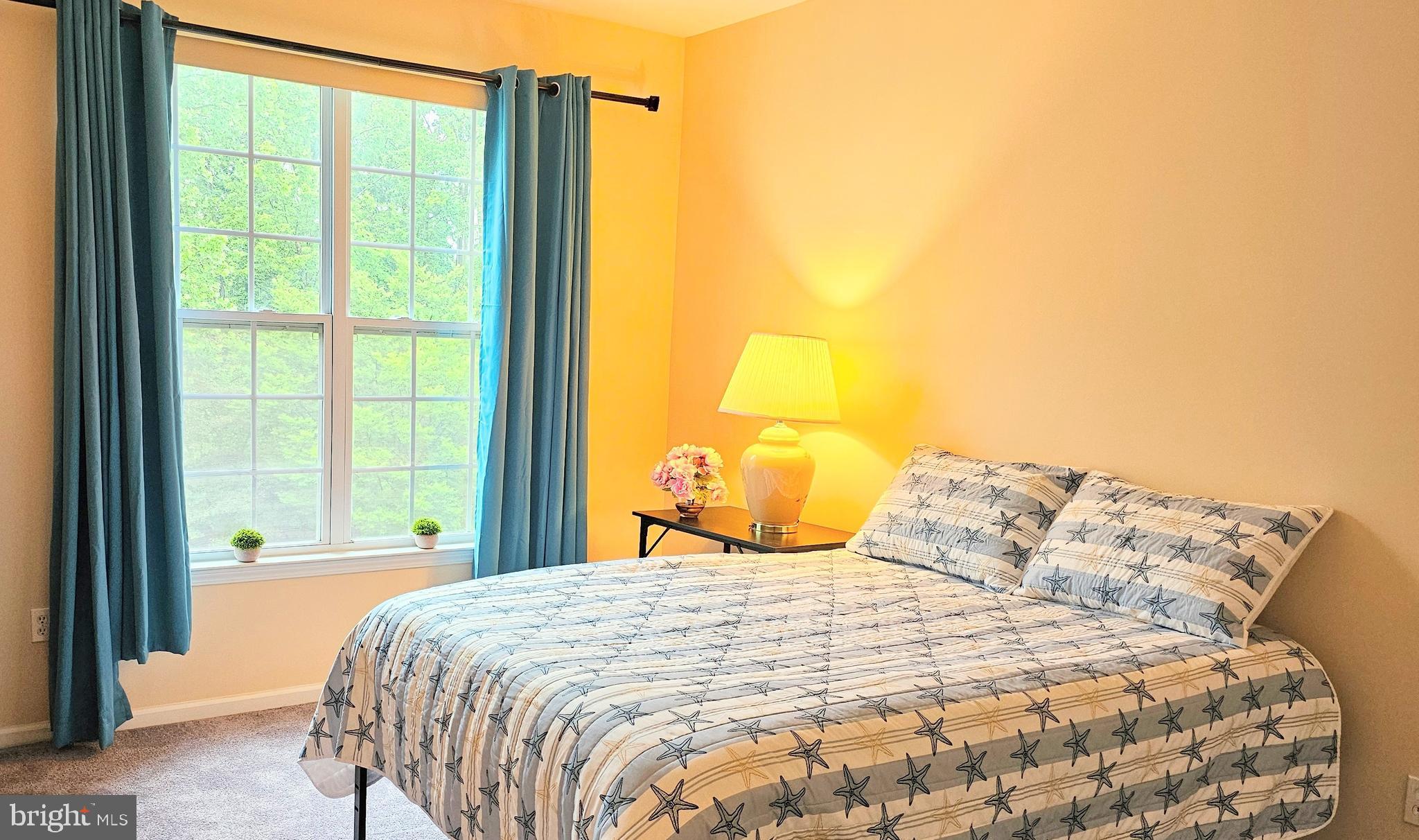 1309 Colts, Unit D Lawrence Township, NJ 08648 - Photo 17 of 33 a large bed sitting in a bedroom next to a window