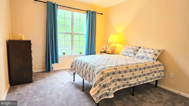 a bedroom with a bed and a cabinets