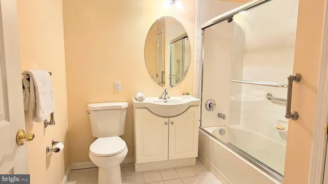 a bathroom with a tub and a large window