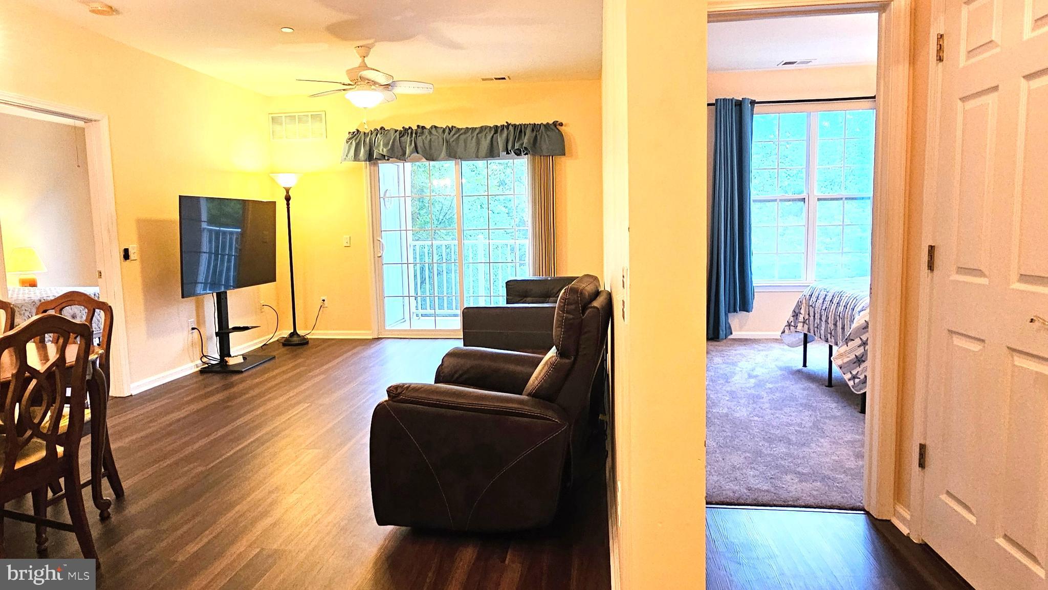 1309 Colts, Unit D Lawrence Township, NJ 08648 - Photo 6 of 33 a living room with furniture and a wooden floor
