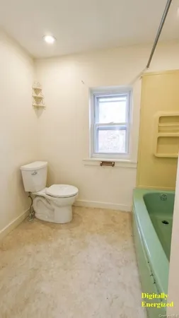 a bathroom with a sink a toilet and a bathtub