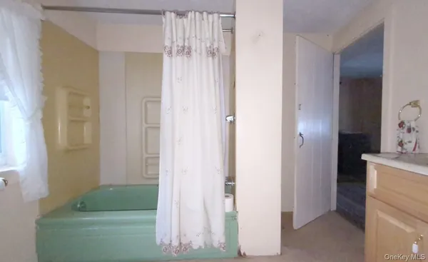 a picture of a room with a white house