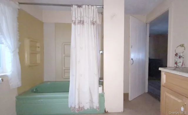 a picture of a room with a white house