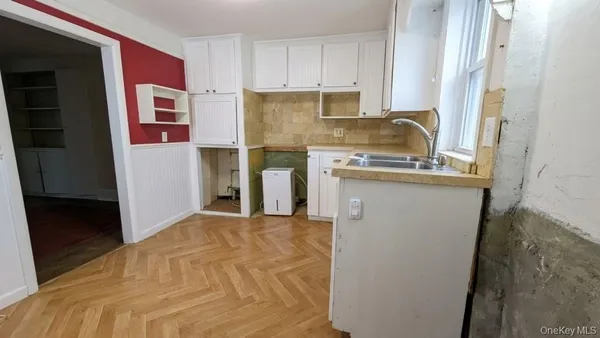 a kitchen with a stove a refrigerator and a sink
