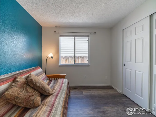 a bathroom with a toilet a sink and shower