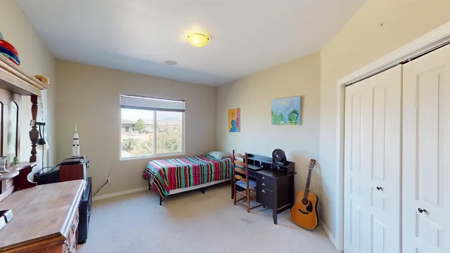 a room with a bed and a window