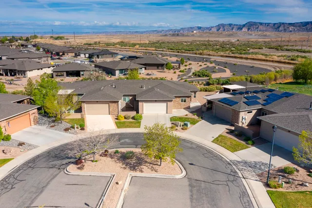 an aerial view of residential houses with outdoor space