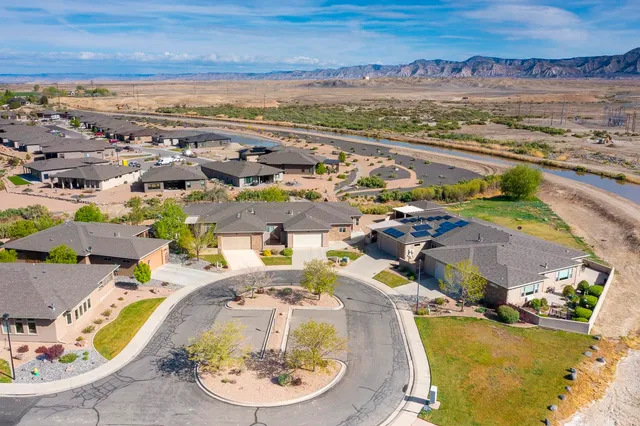 an aerial view of residential houses with outdoor space