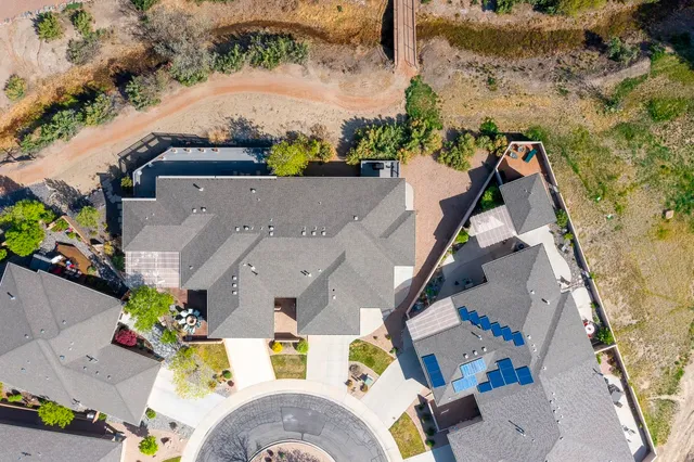 an aerial view of residential houses with outdoor space