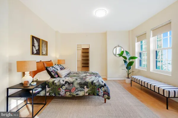 a bedroom with bed and a window