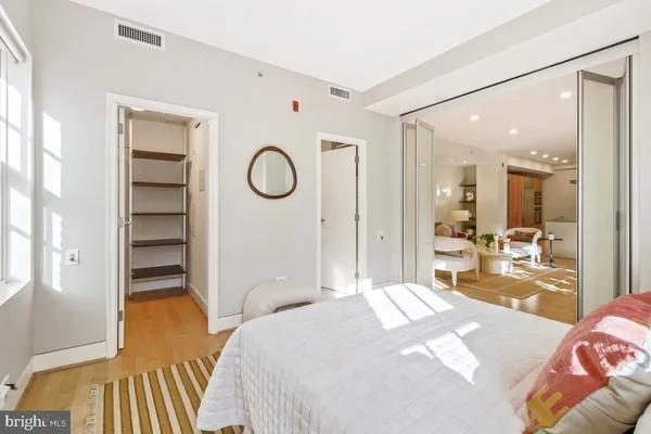 a bedroom with a bed and a view of bedroom