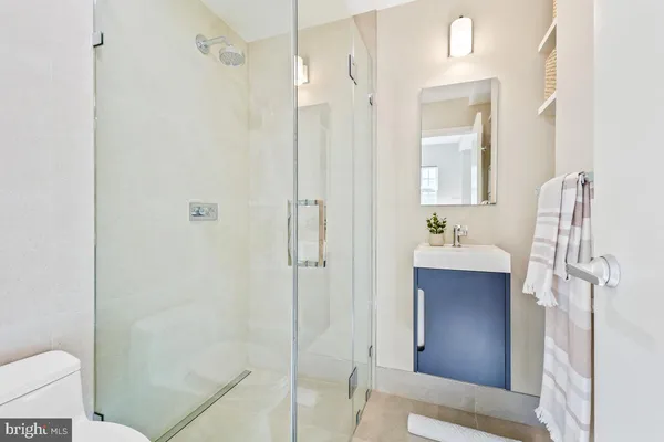 a bathroom with a shower and a sink