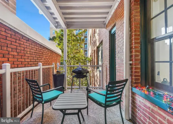 a view of a chairs and tables in the balcony