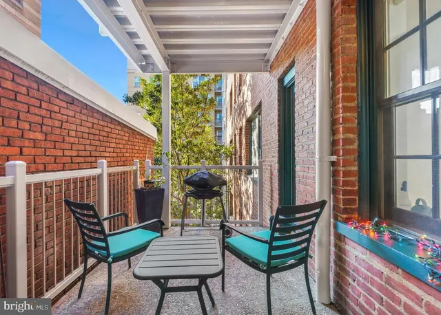 a view of a chairs and tables in the balcony