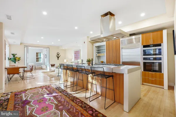 a kitchen with stainless steel appliances granite countertop a stove and a refrigerator