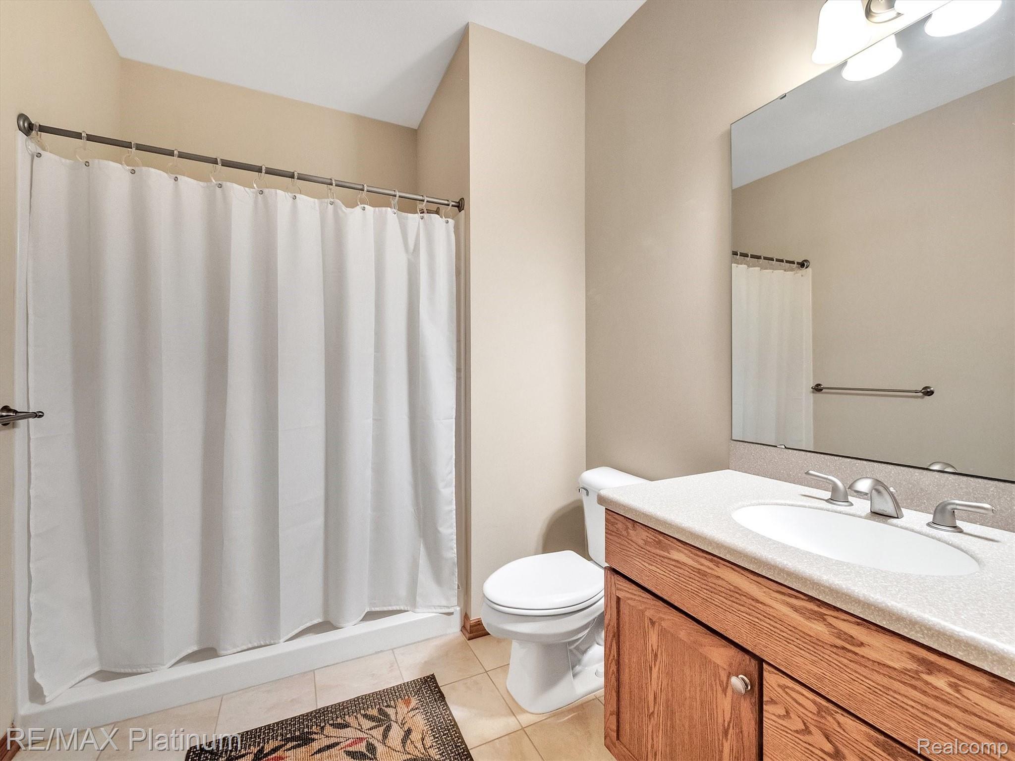 11061 Wiggins Road Howell, MI 48855 - Photo 25 of 79 MAIN FLOOR FULL BATH WITH CERAMIC FLOOR