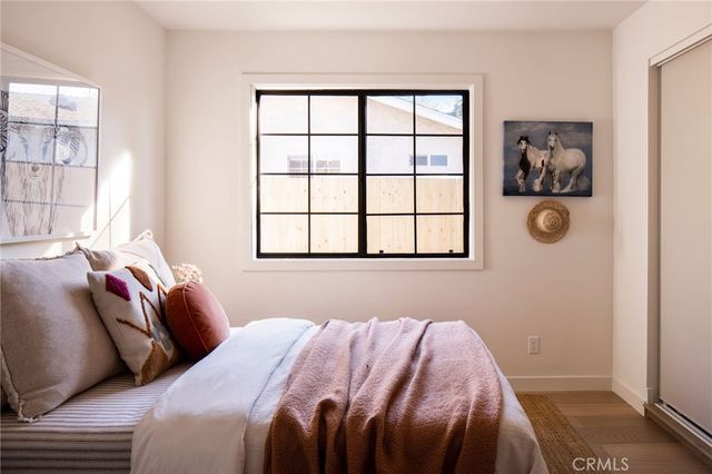 a bedroom with a bed and a chair