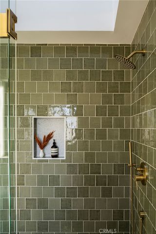 a view of a chairs and table on the roof deck