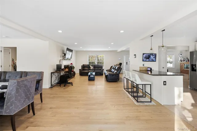 a bathroom with a sink mirror vanity and toilet