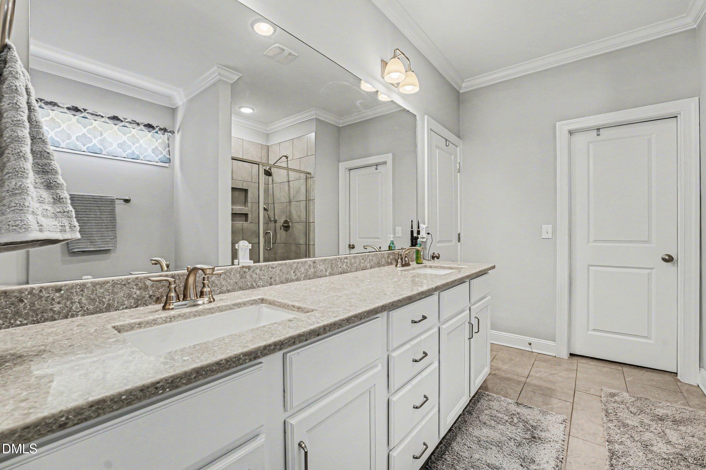 130 Aylebury Ridge Zebulon, NC 27597 - Photo 20 of 41 a bathroom with a granite countertop sink double and mirror