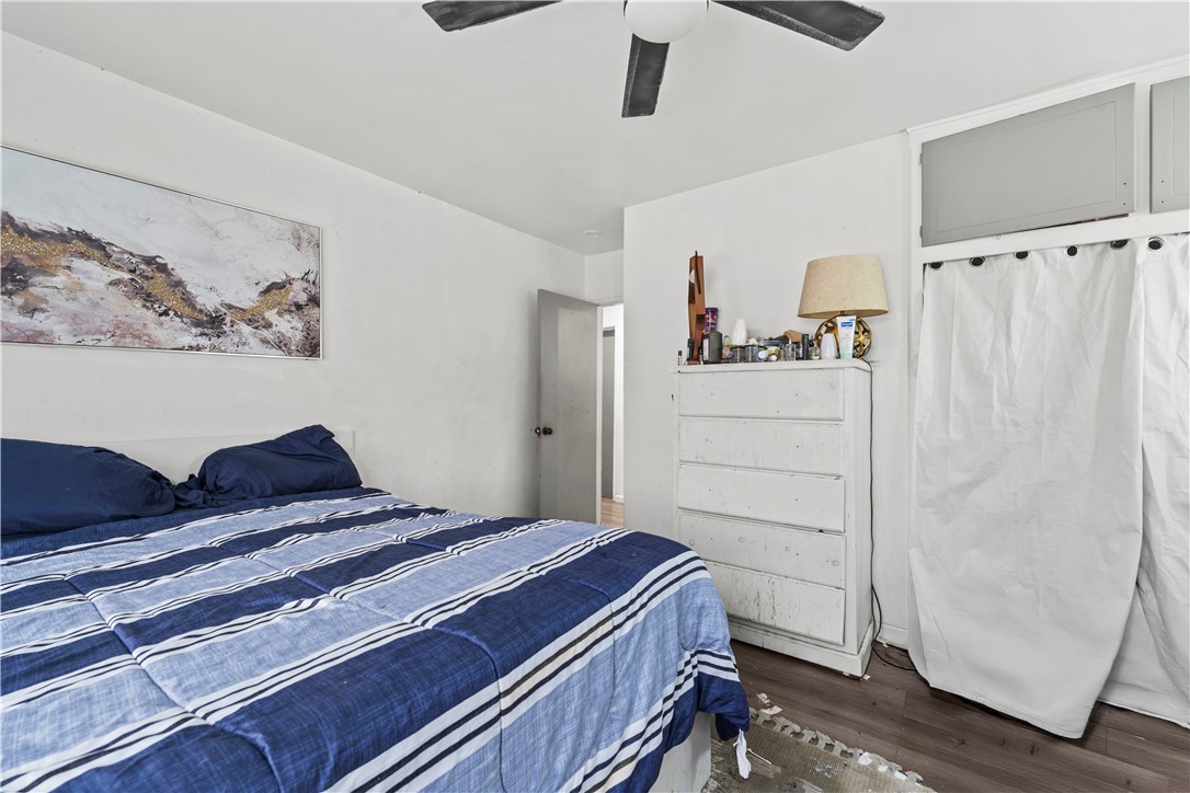 2725 East Tyler Street Carson, CA 90810 - Photo 12 of 30 a bedroom with a bed and cabinets
