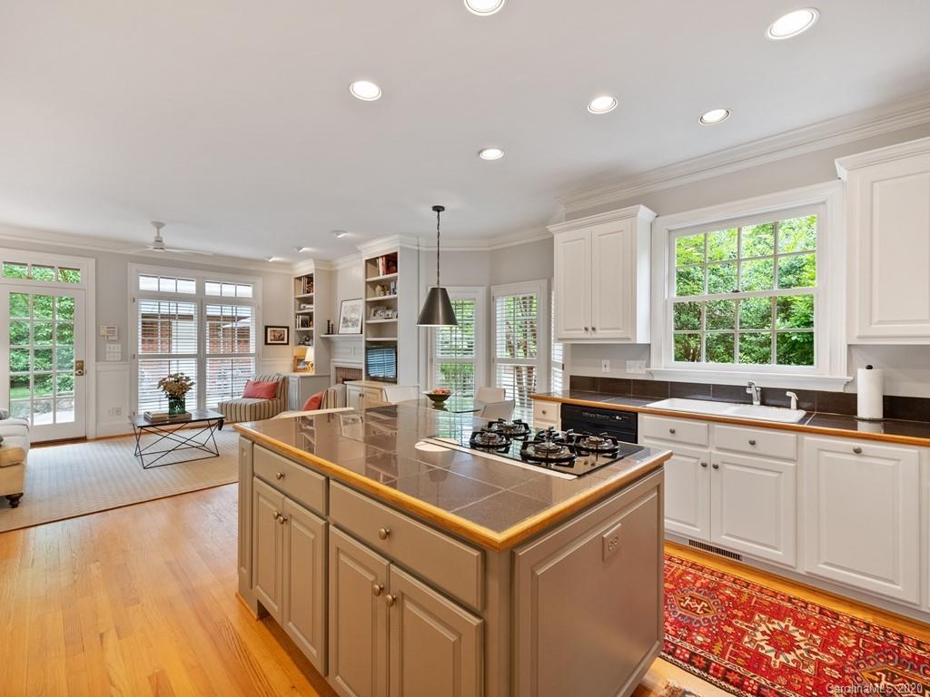 2440 Overhill Road Charlotte, NC 28211 - Photo 22 of 48 a kitchen that has a sink and a stove in it
