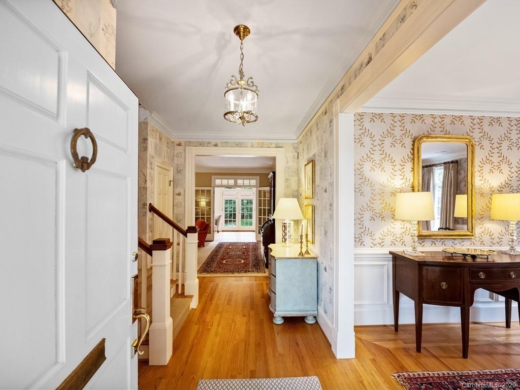 2440 Overhill Road Charlotte, NC 28211 - Photo 4 of 48 a view of a livingroom with furniture wooden floor a chandelier