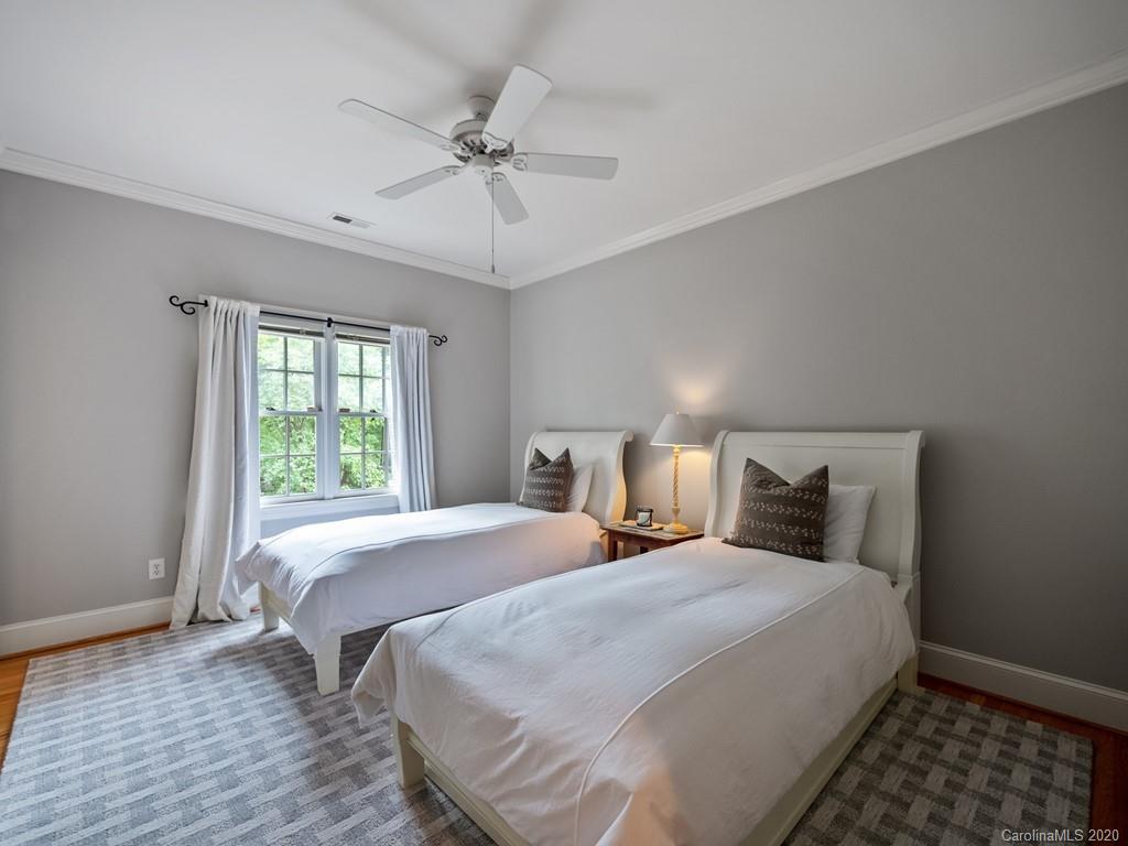 2440 Overhill Road Charlotte, NC 28211 - Photo 36 of 48 a bedroom with a bed and a window