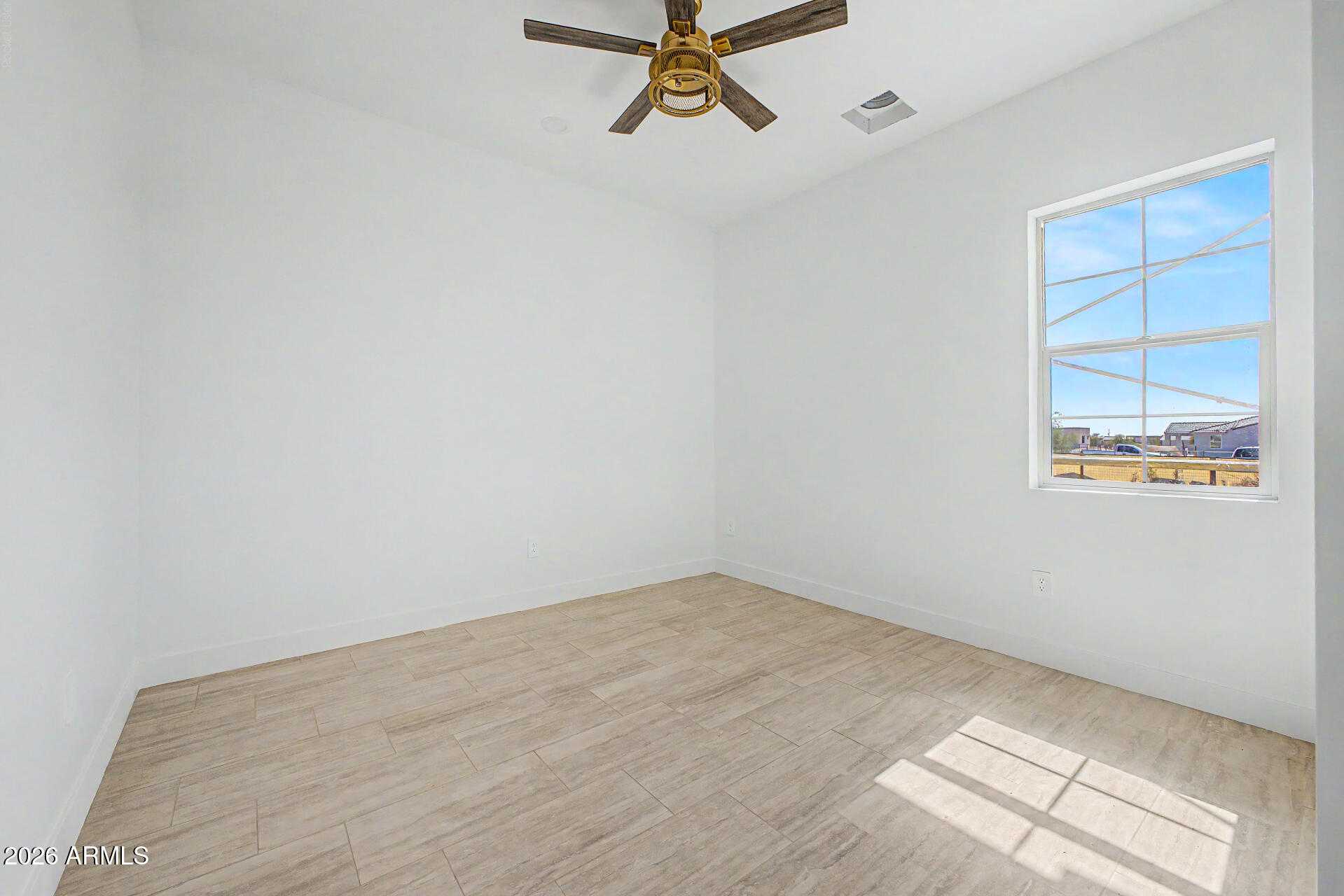 18815 West Arlington Road Buckeye, AZ 85326 - Photo 38 of 56 an empty room with windows and closet