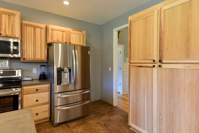 1754 Vesta Road Lebanon, TN 37090 - Photo 14 of 37 a kitchen with stainless steel appliances a refrigerator and cabinets