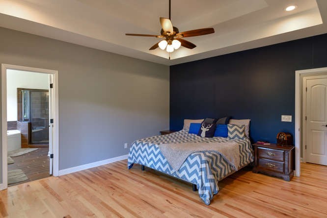 1754 Vesta Road Lebanon, TN 37090 - Photo 18 of 37 a bedroom with a bed and a chandelier