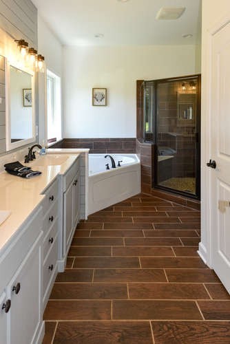 1754 Vesta Road Lebanon, TN 37090 - Photo 21 of 37 a bathroom with a sink a mirror and a bathtub