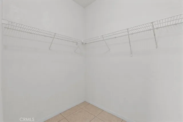 a view of a livingroom with a ceiling fan and window