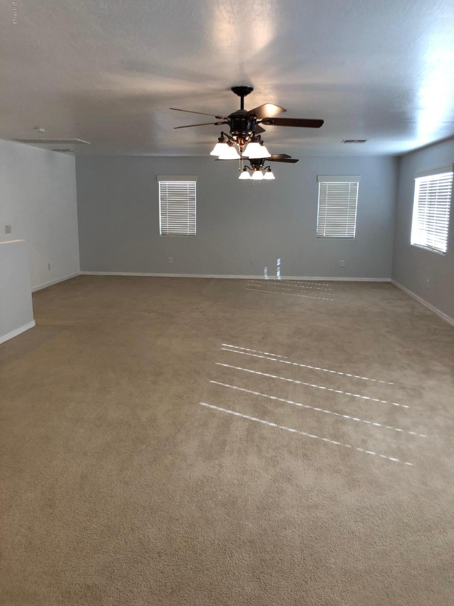 16741 West Tether Trail Surprise, AZ 85387 - Photo 20 of 20 a view of empty room with windows